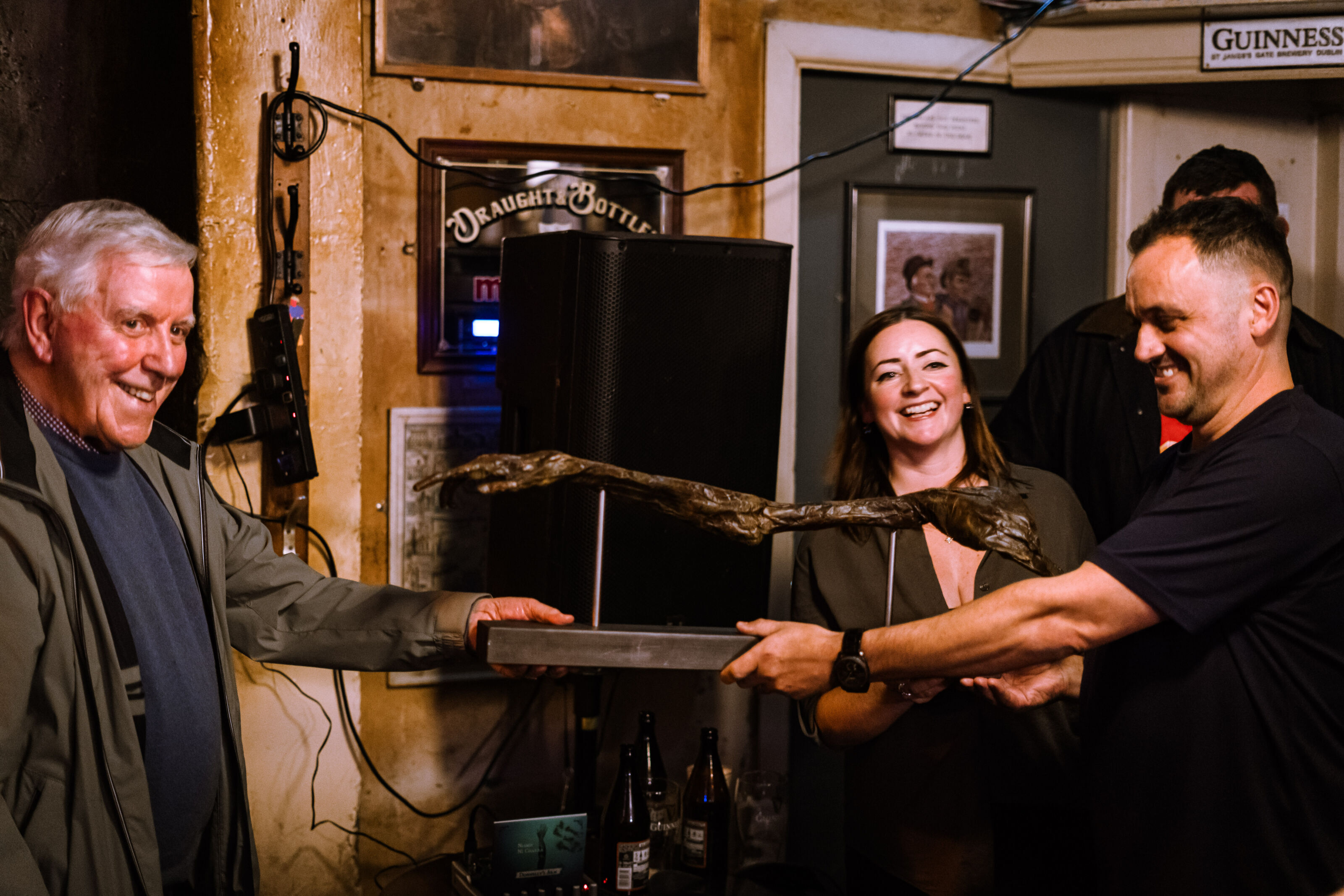 Patrick Myler and Grace McEvoy hand over the replica to Fallon's
