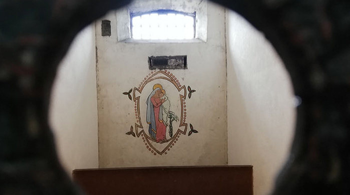 Cell of Grace Gifford Plunkett depicting a mural of Madonna and Child at Kilmainham Gaol